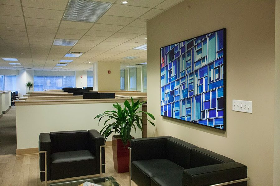 Client Feedback - Closeup View of a Waiting Room Area with a Mosaic Portrait on the Wall Inside the Evarts Tremaine Office Building