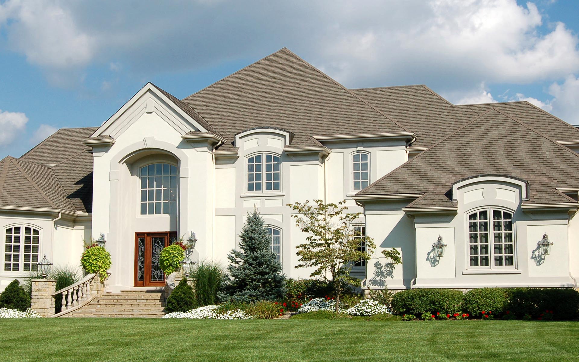 Sterling - Modern Large Three Story Home with White Walls, a Red Door, and Gray Roof on a Nice Day